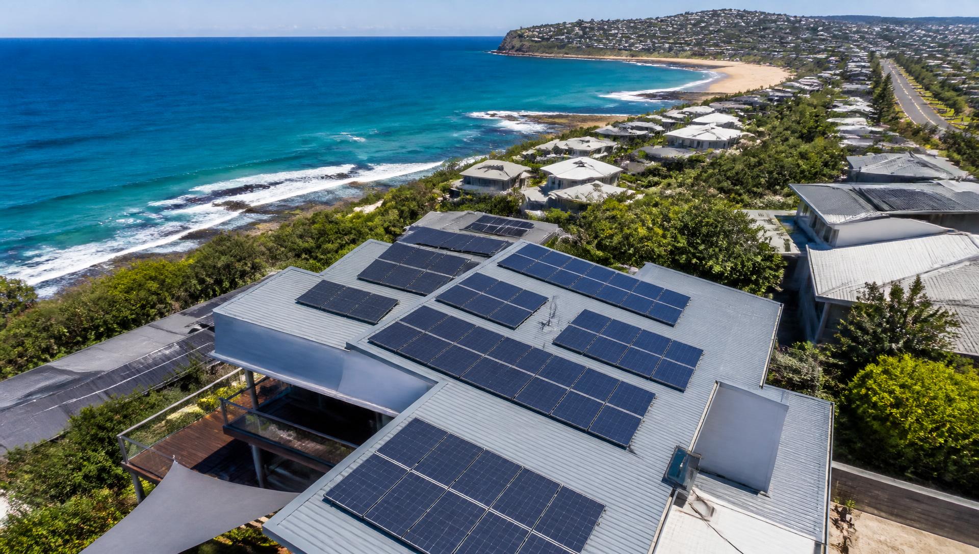 Aerial view of a solar panel installation on an Australian coastline